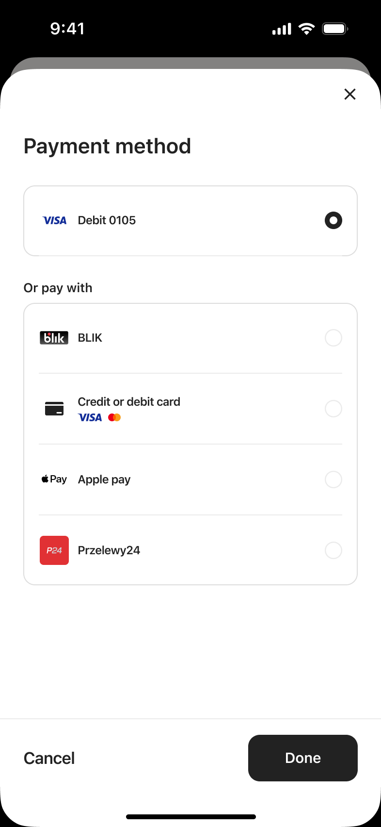 Payment method picker with saved debit card selected and other ways to pay.