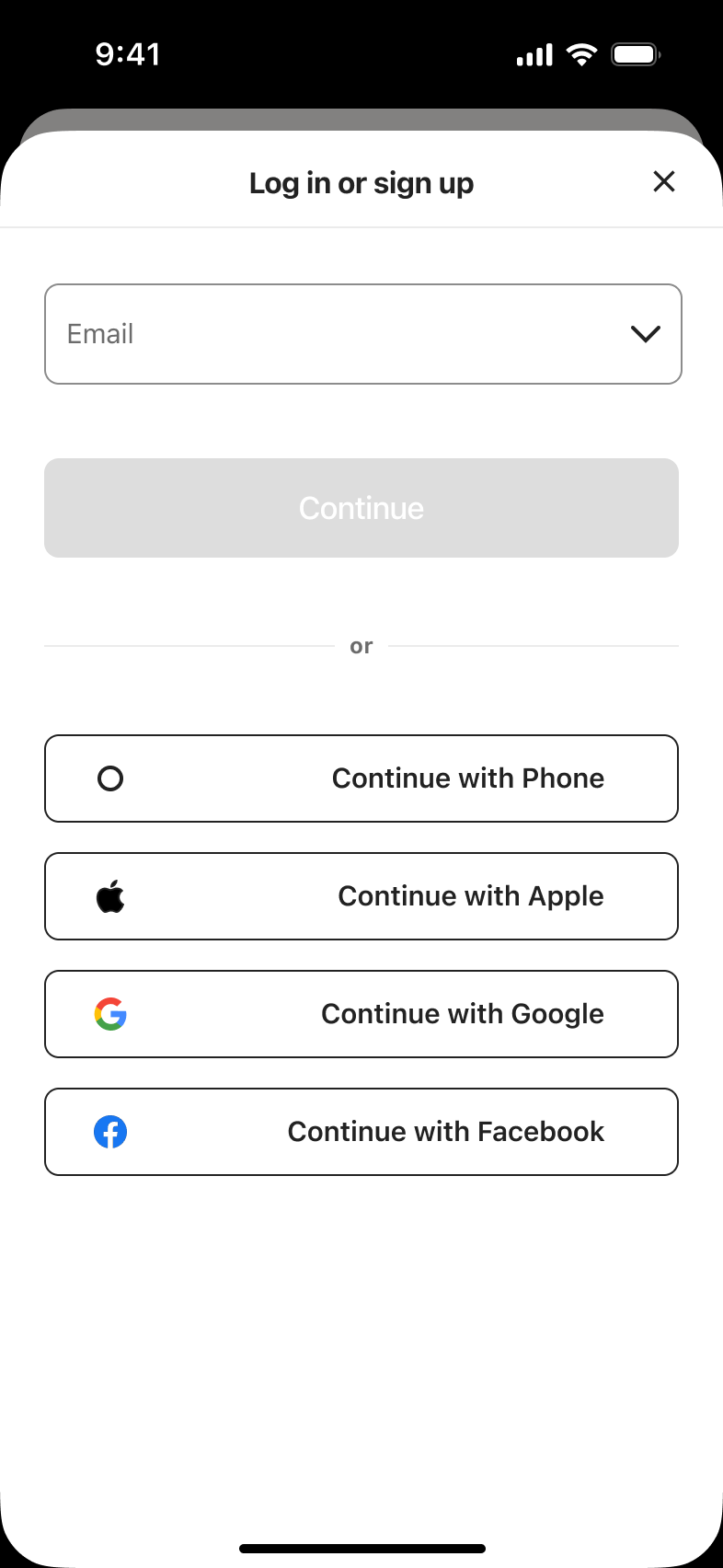 Log in or sign up with email: empty email field, disabled continue and phone, Apple, Google, Facebook alternatives.