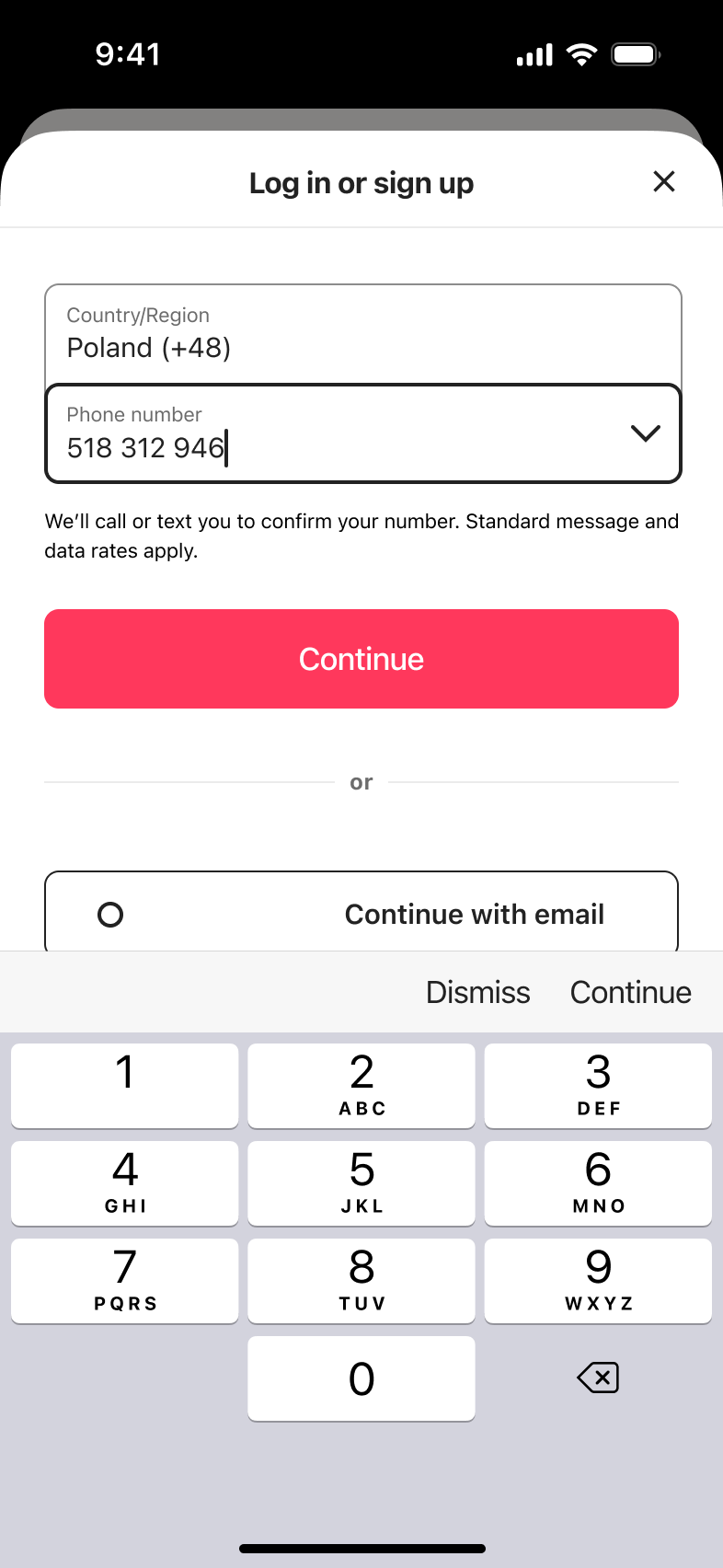 Phone number being typed on numeric keypad in the log in or sign up form.