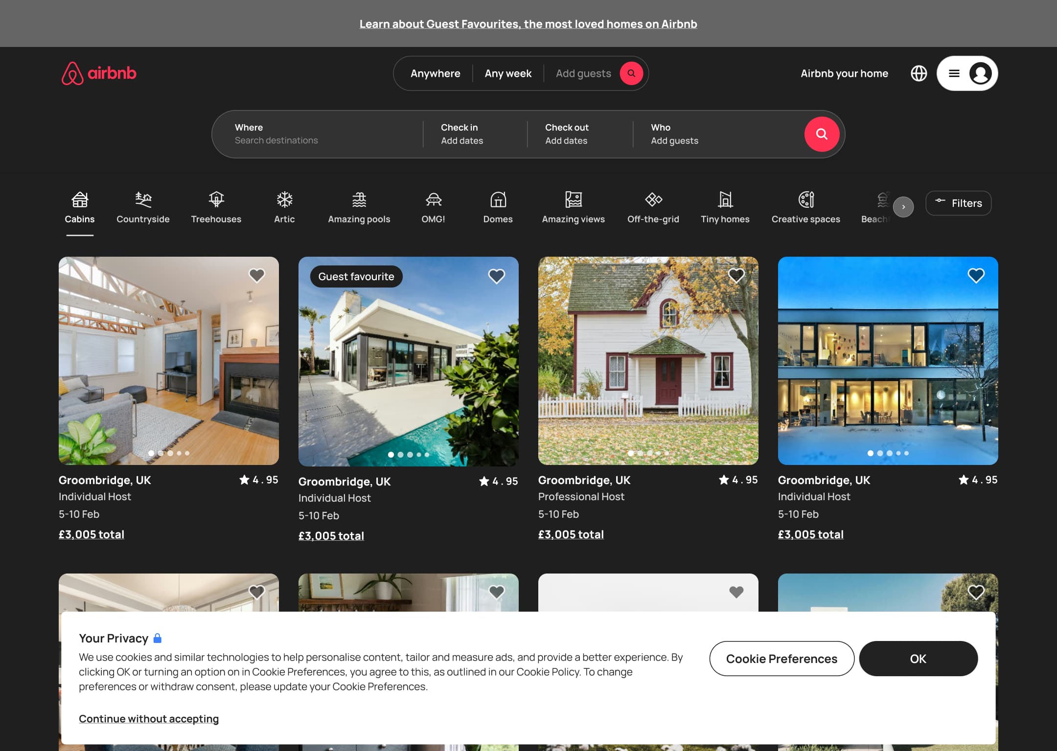 Dark mode: desktop home with privacy cookie banner: preferences, OK or continue without accepting.