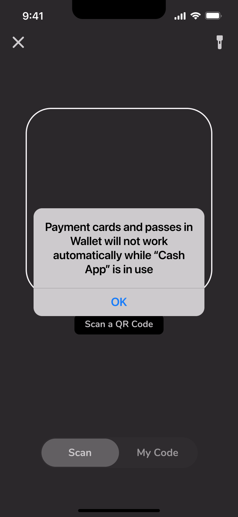 Scan a QR code camera with wallet passes notice alert.