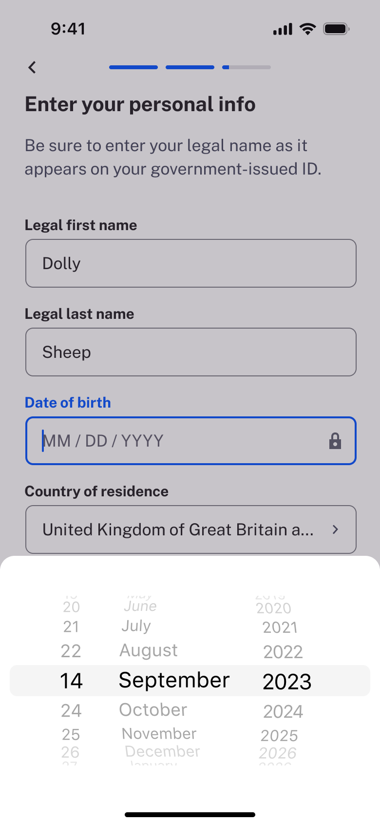 Birth date wheel picker opened.