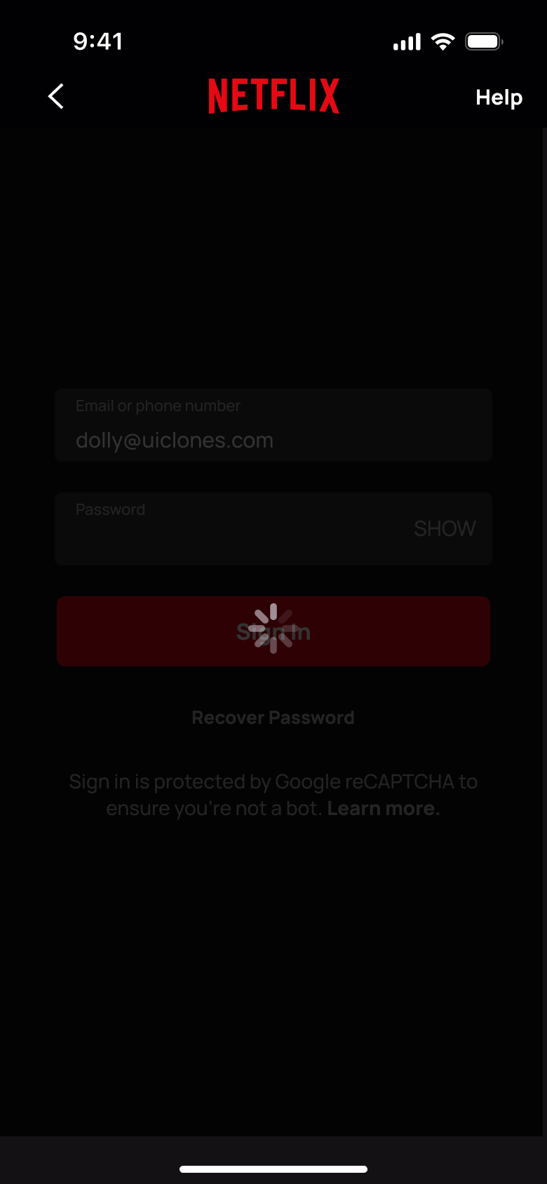 Signing in: form dimmed with a spinner on the button.