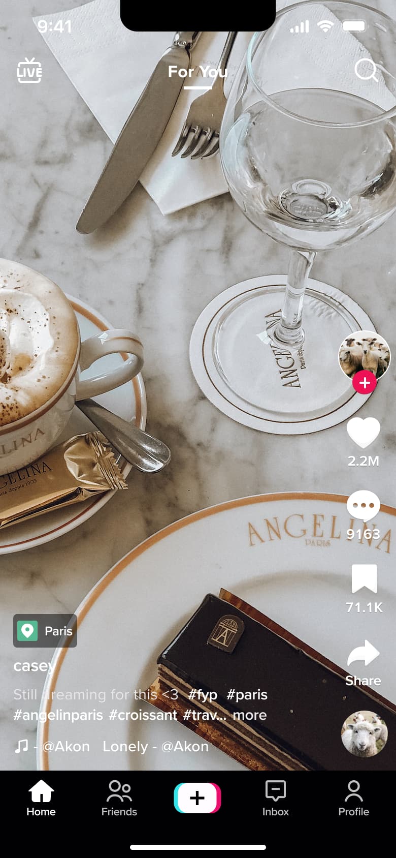 Feed video with location chip and hashtags.