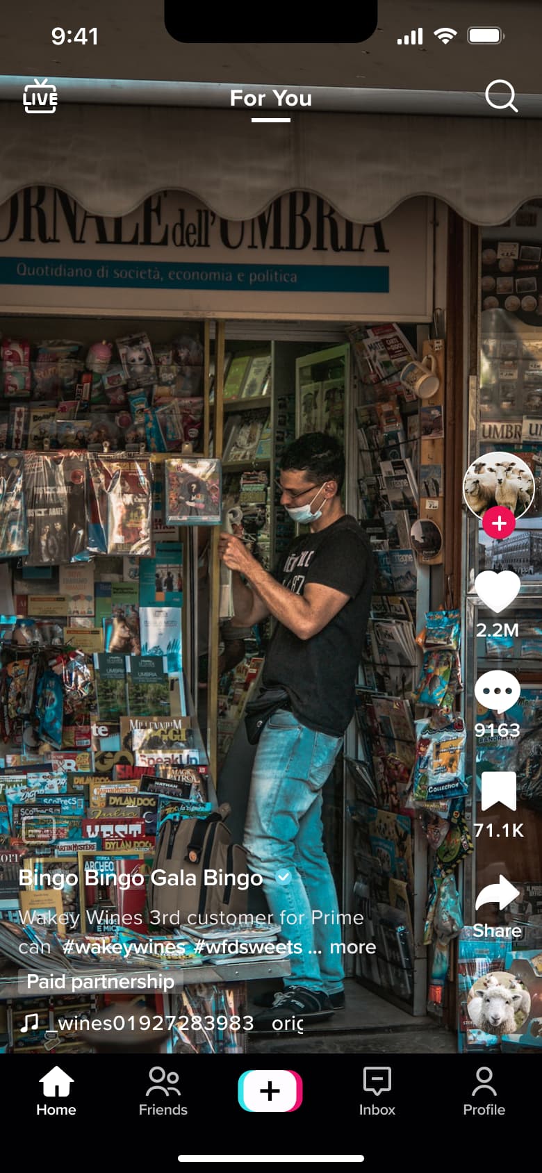 Feed video with group chip and long caption.